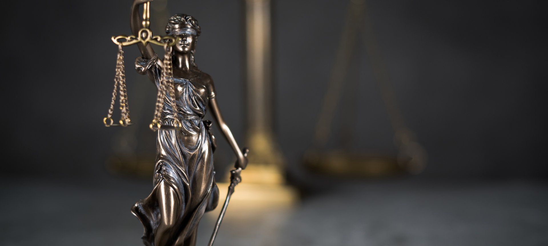 Lady Justice statue with scales — Winning Your Case in Southfield, MI